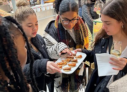 Hartwick students tasting food in Portugal