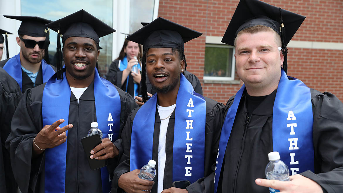 Hartwick College graduates after Last Walk on Founders' Way