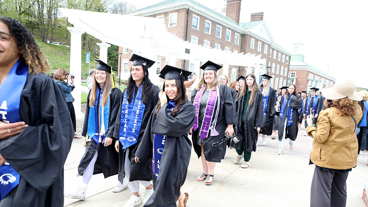 Hartwick College graduates of the Class of 2024 on Last Walk on Founders' Way