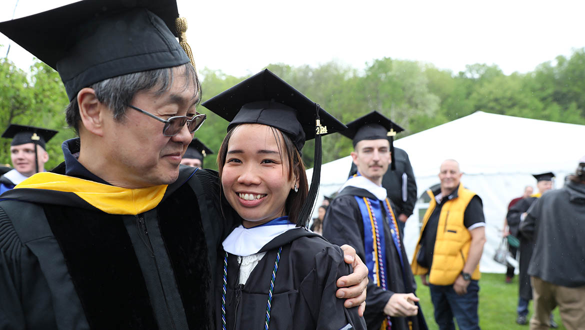 Bunn Award recipient Dr. Min Chung with student after Hartwick College Commencement ceremony