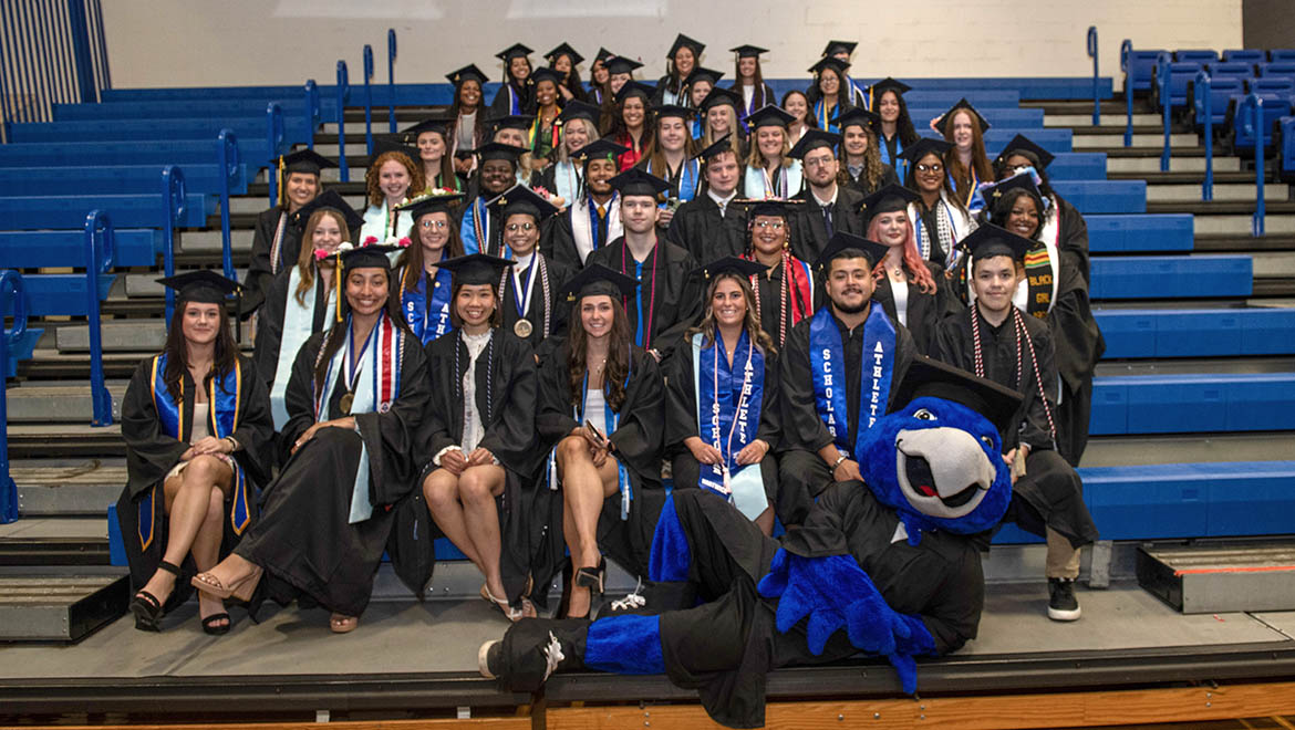 Hartwick College First Generation Graduates of the Class of 2024 before Commencement with Swoop, Hartwick mascot