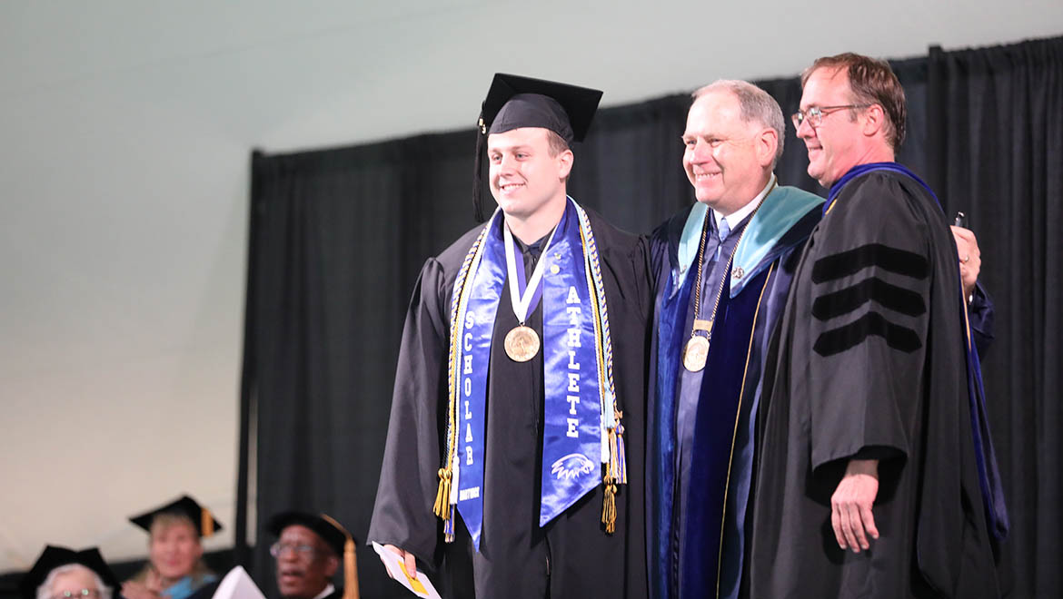 Michael Demarais ’24, Abraham L. Kellogg Oratorical Prize recipient with Interim President Mullen and James Buthman, Associate Professor of Political Science and Faculty Chair