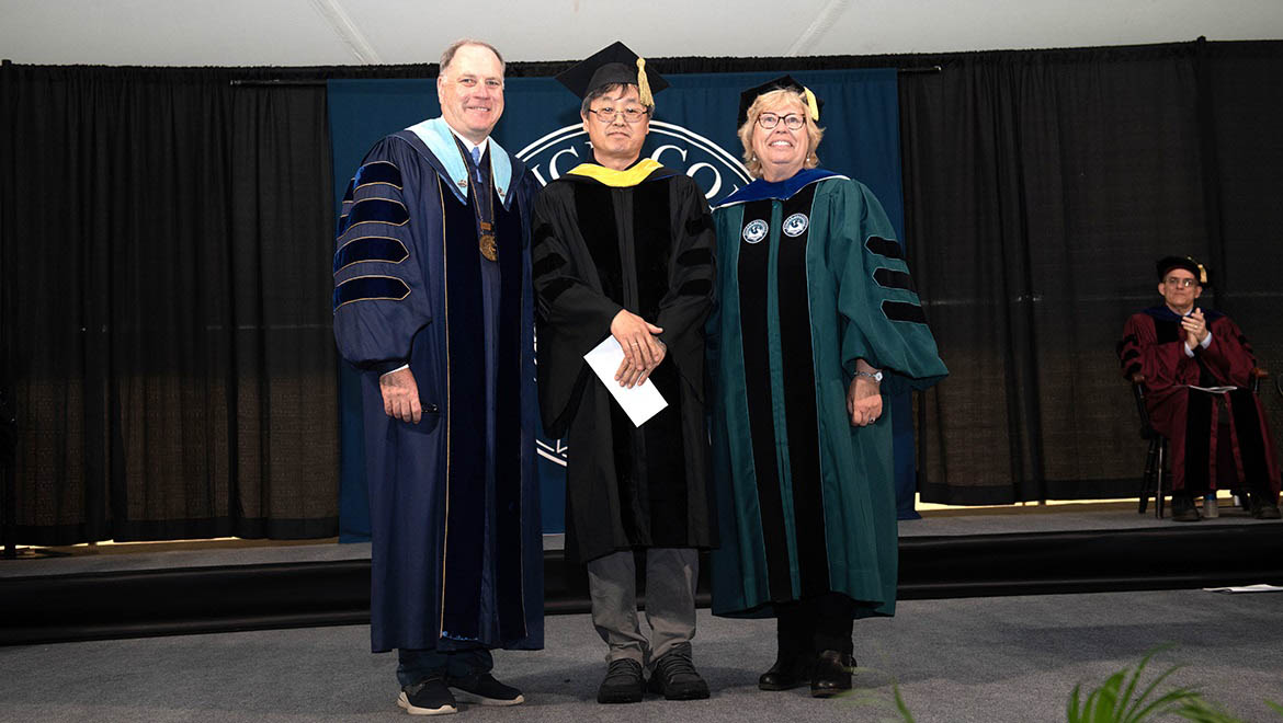 Margaret B. Bunn Award for Outstanding Teaching recipient Min Chung, professor of mathematics with Interim President Mullen and Laurel Bongiorno, VP for Academic Affairs and Provost