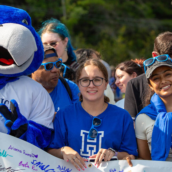 Hartwick College new students with Swoop and class banner before First Walk during Wick Week