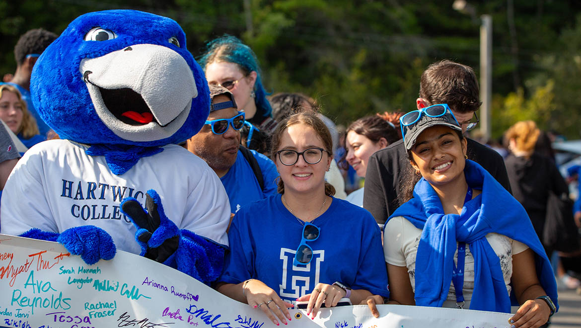 Hartwick College new students with Swoop and class banner before First Walk during Wick Week