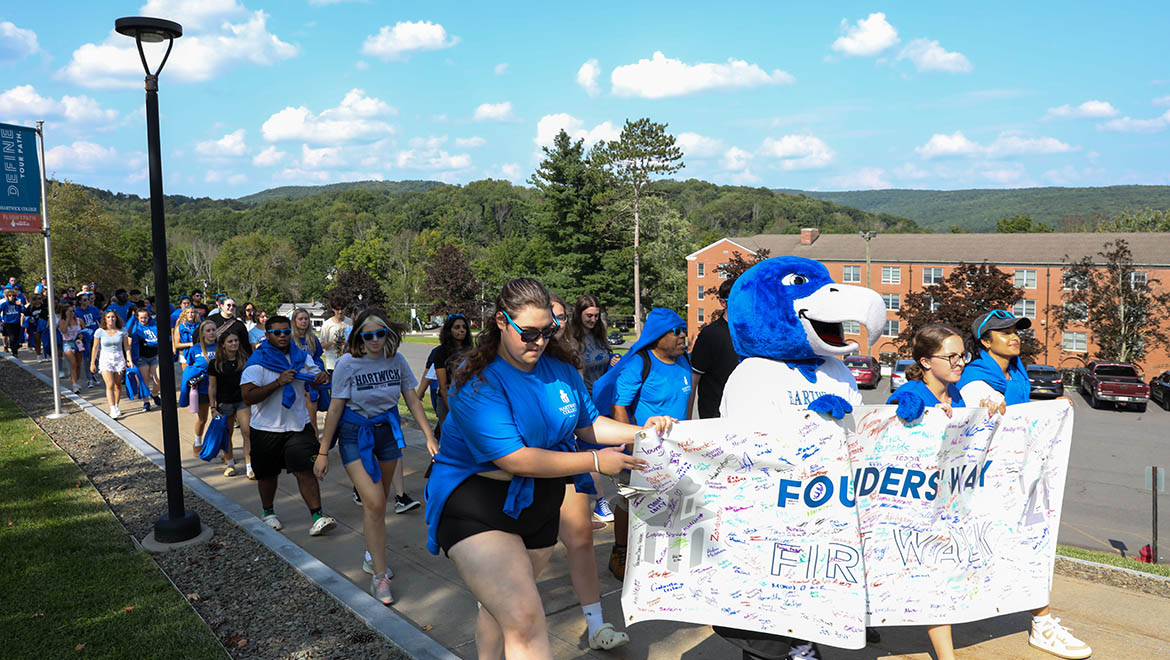 Hartwick College new students with class banner on Founders' Way First Walk during Wick Week