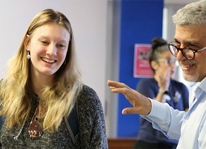 Hartwick College student with staff member