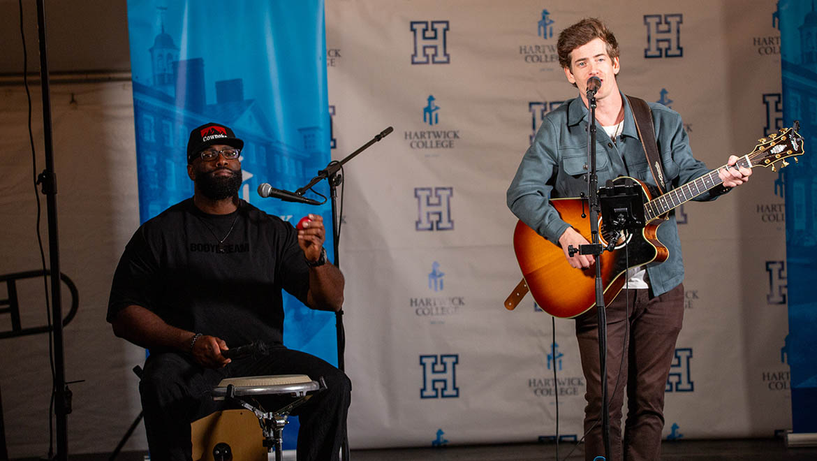 Hartwick College alumnus Drew Angus '11 singing during True Blue Weekend