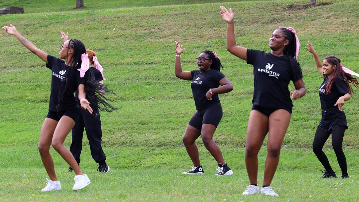 Hartwick College Hawkettes Dance Team dancing on Frisbee Field during Block Party