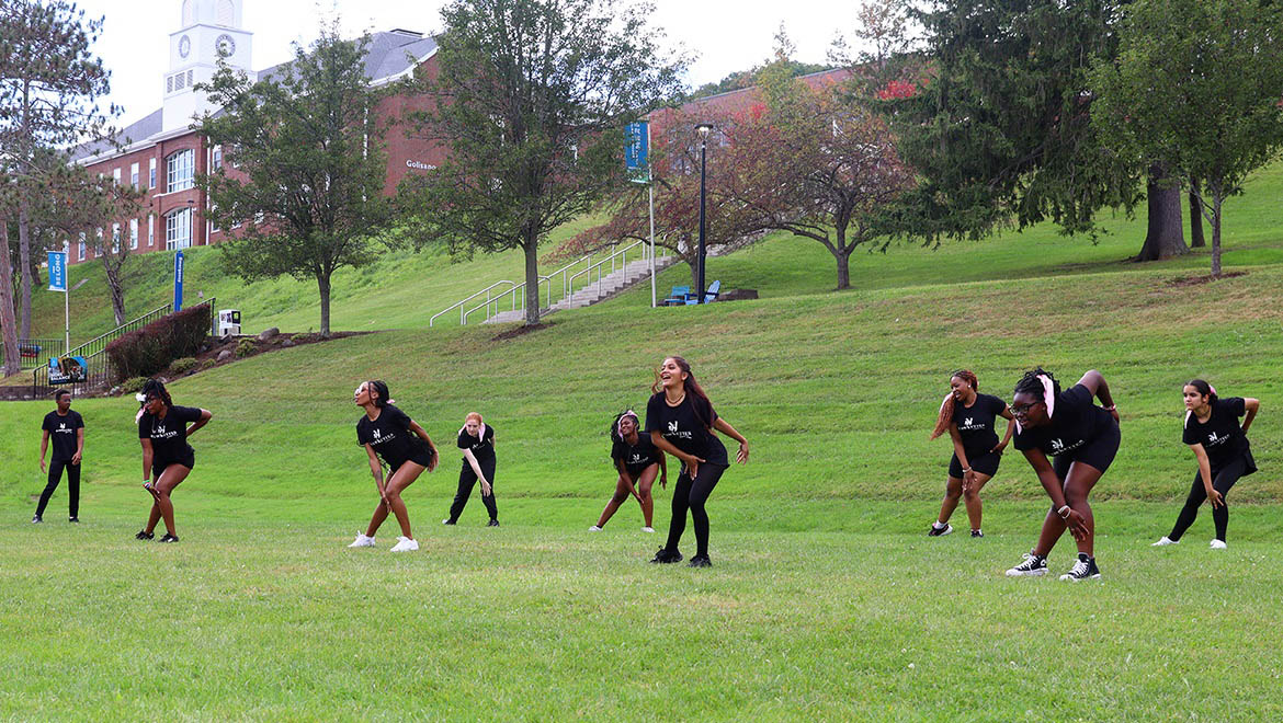 Hartwick College Hawkettes Dance Team dancing on Frisbee Field during Block Party