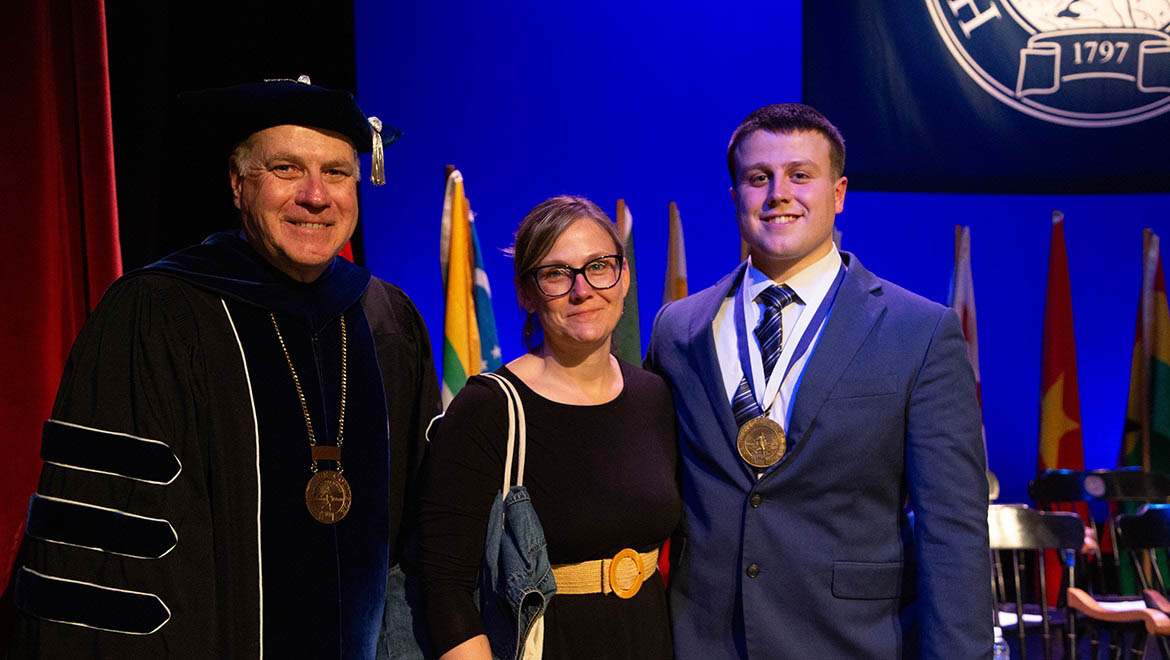 Michael Demarais '24 with Mother and President Mullen at Honors Convocation 2024