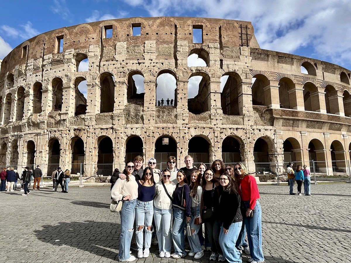 Hartwick students in Italy in front of Roman Colosseum